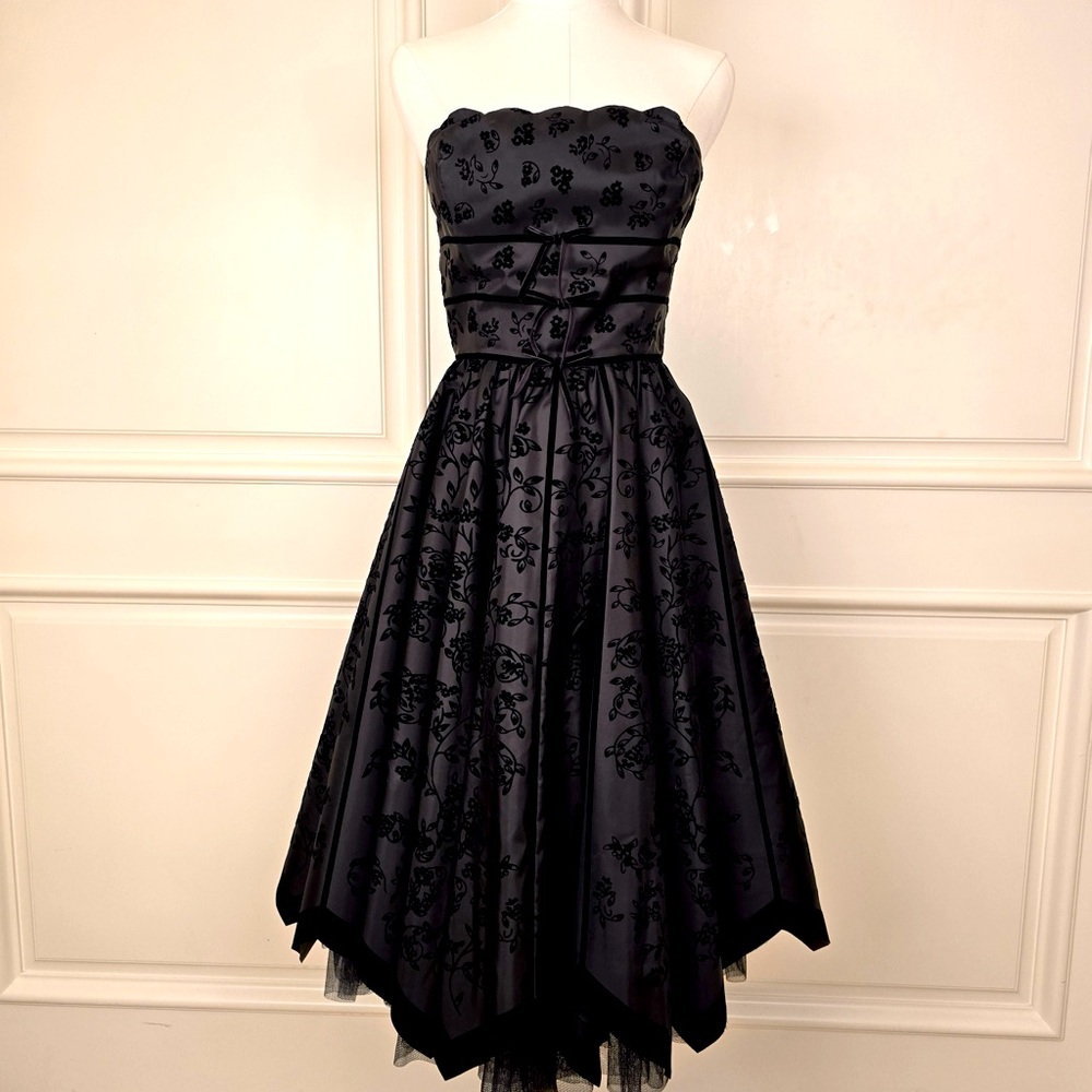 A strapless black Betsey Johnson mini dress size 4